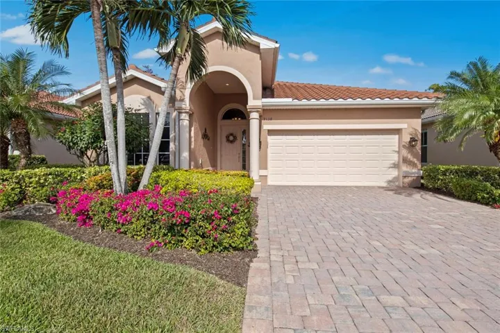 Mediterranean / spanish-style house with a garage