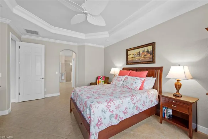 Hall in master leads to walk-in closets, en-suite bath