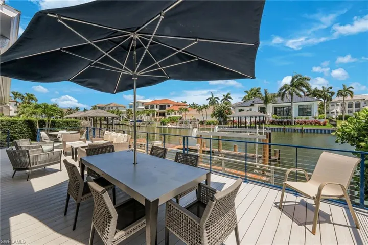 Expansive outdoor deck with composite wood-look flooring and a durable metal railing