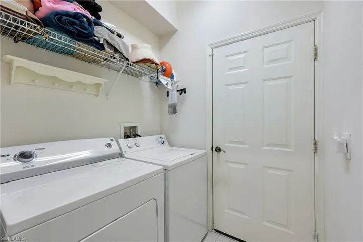 Clothes washing area with washing machine and clothes dryer