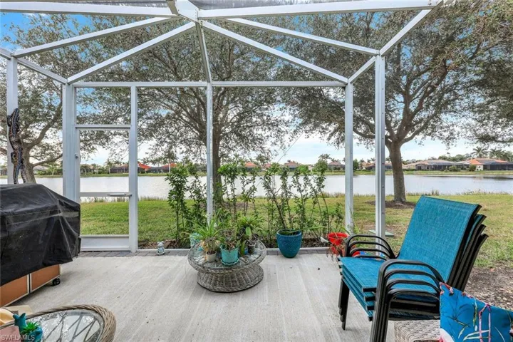 Sunroom featuring a water view
