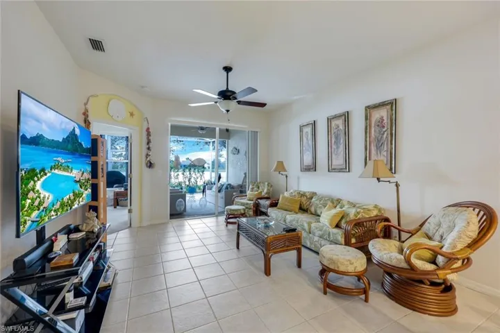 Tiled living room with ceiling fan
