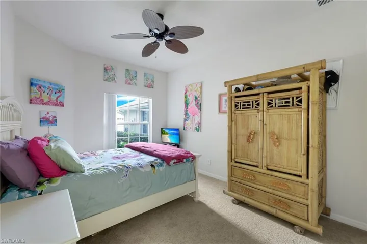 Bedroom featuring ceiling fan and carpet floors
