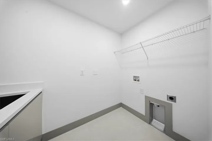 Unfurnished bedroom with a spacious closet, ceiling fan, recessed lighting, and a tray ceiling