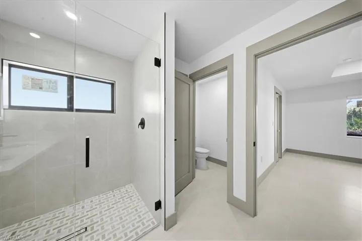 Bedroom featuring a ceiling fan and a closet