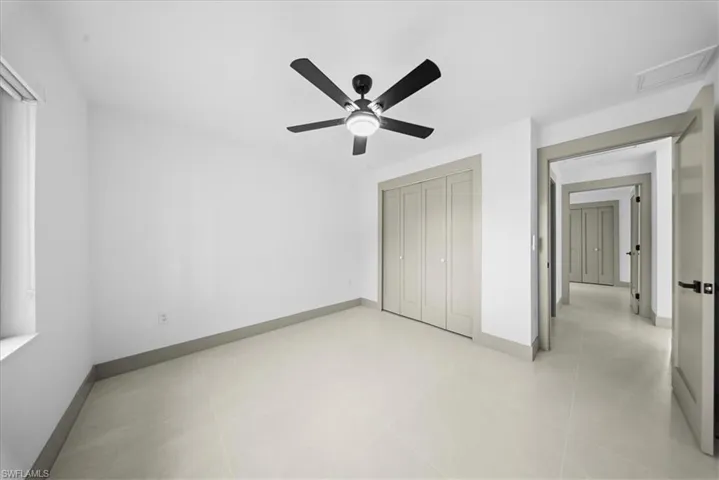 Spare room featuring baseboards and recessed lighting