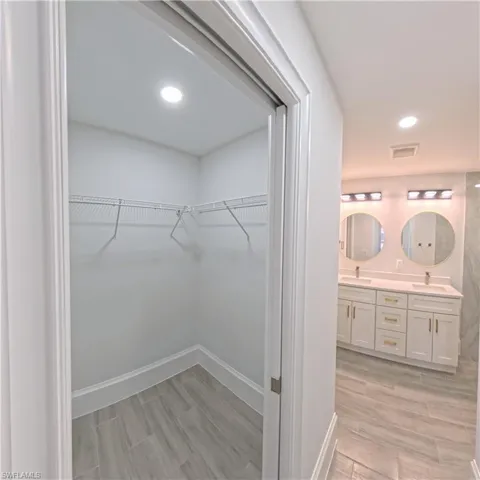 Closet featuring wire shelving and recessed lighting
