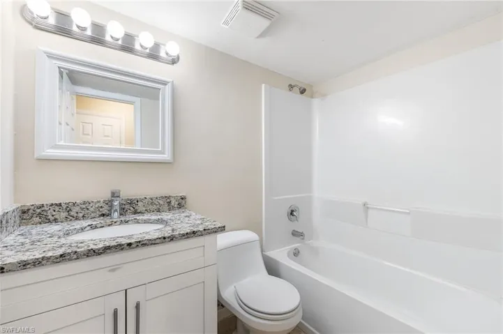 Full bathroom with vanity and bathtub / shower combination