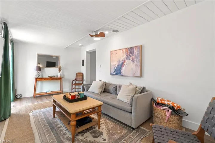 Living room with wood-type flooring