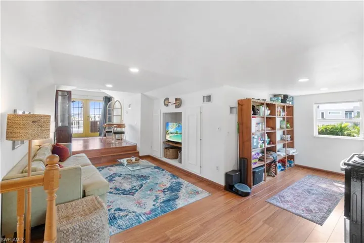 Living room featuring light hardwood / wood-style flooring and french doors