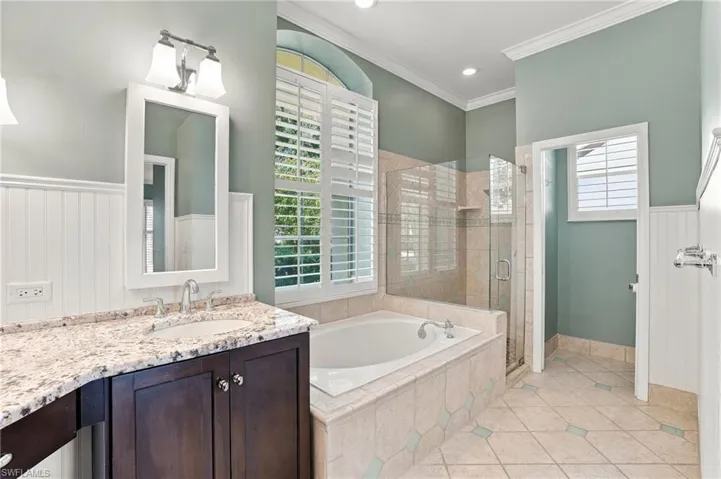 Private water closet and step in frameless glass shower