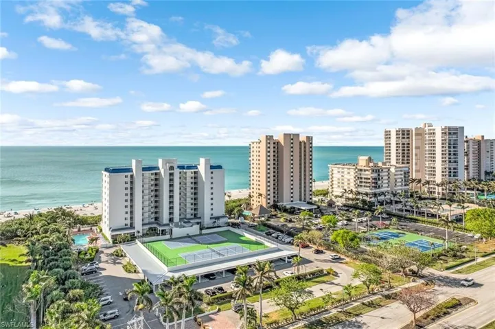 Bird's eye view of expansive coastline and apartment complex / building