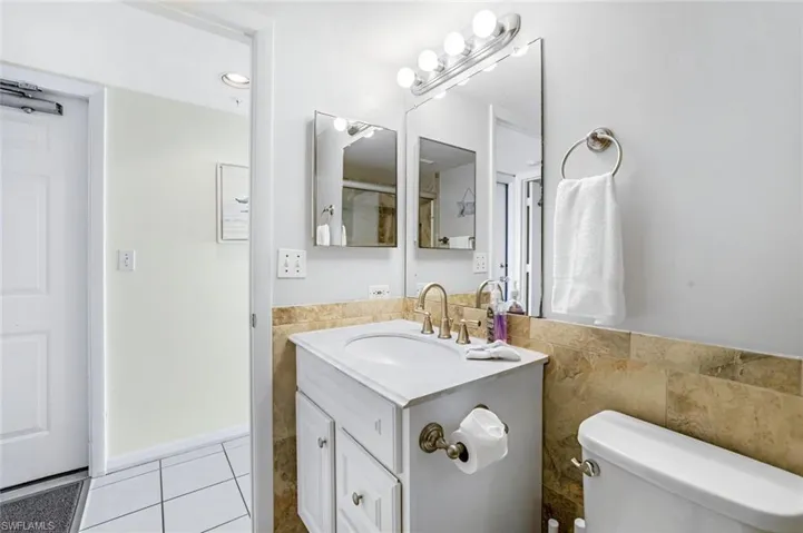 Bathroom with vanity and light tile patterned floors