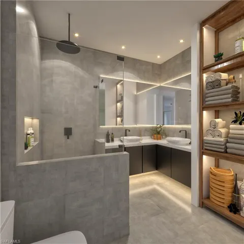 Bathroom featuring double vanity, a walk in shower, and recessed lighting