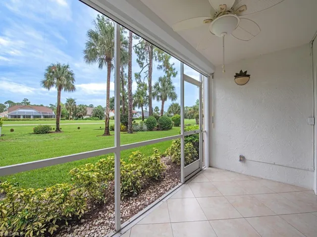 Unfurnished sunroom featuring ceiling fan