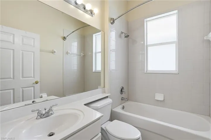 Bathroom featuring vanity and tub / shower combination - Virtually Edited Image