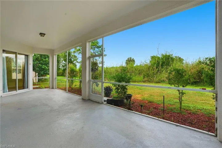 Unfurnished sunroom featuring concrete flooring - Virtually Edited Image