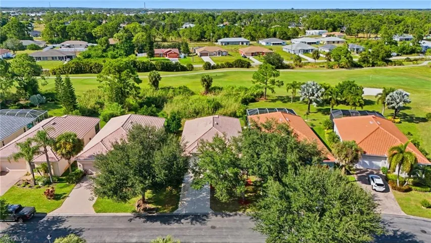 Aerial perspective of suburban area with a golf club - Virtually Edited Image