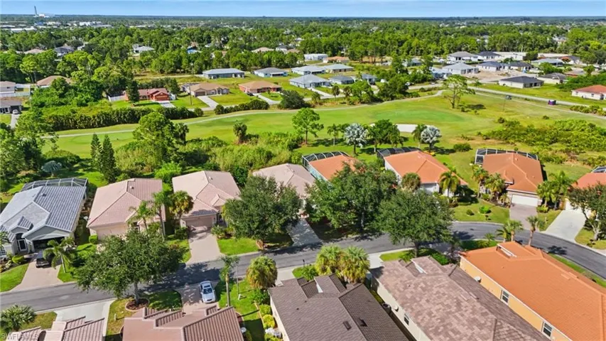 Aerial view of residential area with a golf club - Virtually Edited Image