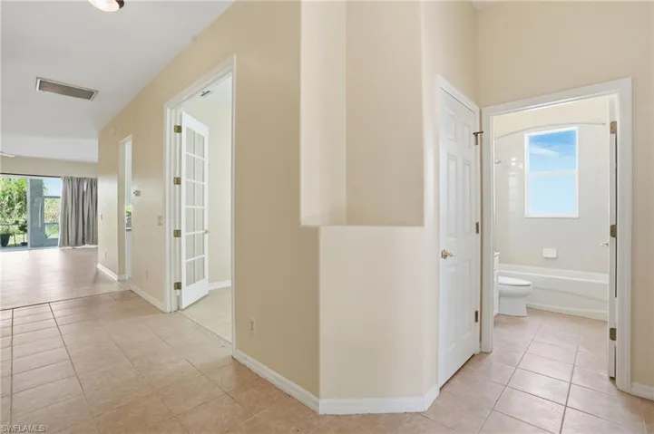 Hall with light tile patterned floors - Virtually Edited Image