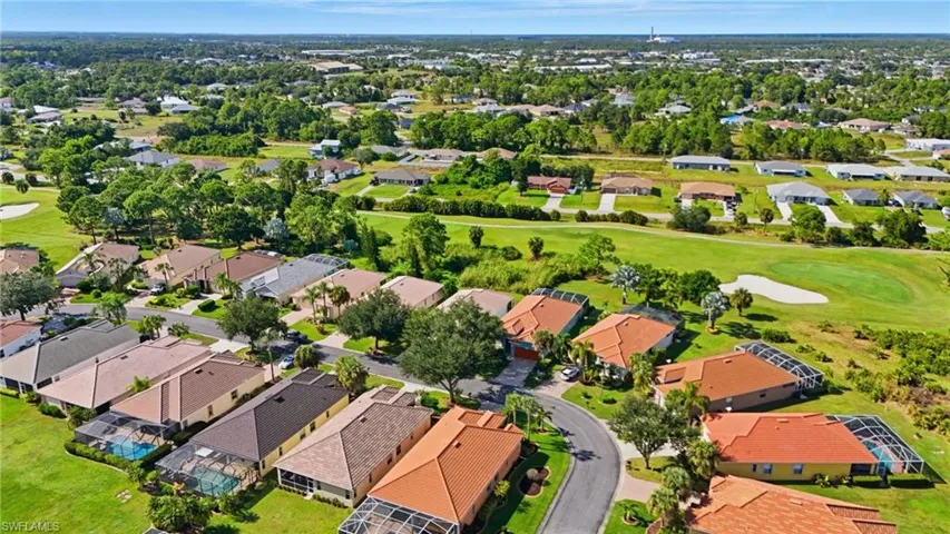 Aerial view of residential area with a golf course - Virtually Edited Image