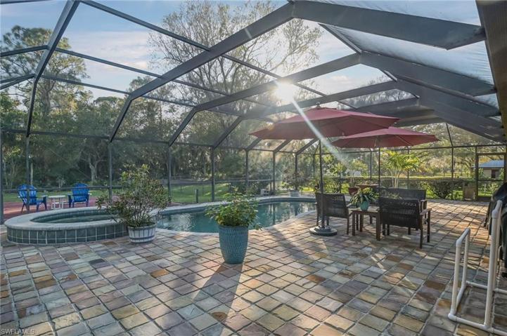 View from the east facing west of the spa and pool.  Big oversized pool enclosure too!