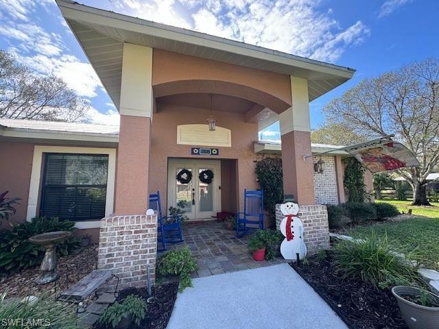 Inviting Entryway with covered rocking chair porch.