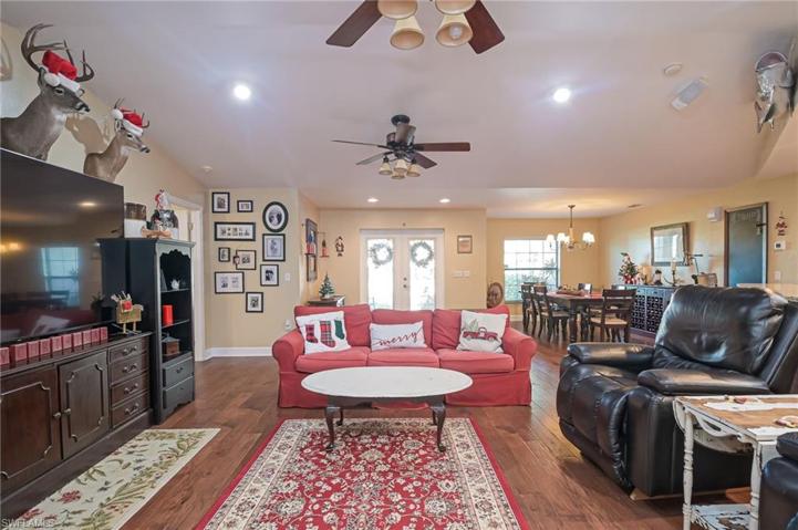 As you enter the home through the glass front doors, your greeted to a comfortable and open great room floorplan with beautiful wood flooring throughout.