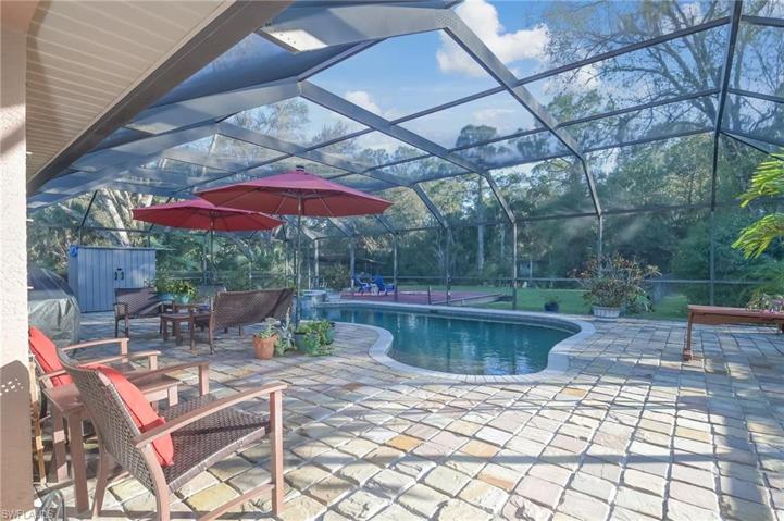 Custom screened pool and spa in 2005 with oversized stone patio and lots of room to entertain and enjoy the SW Florida weather year round.