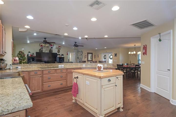 View from kitchen facing the living/dining area.  Butcher block island perfect for preparing meals.