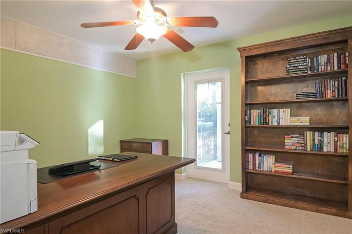 Office or second bedroom with glass door to pool and patio.