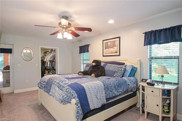 Roomy master suite with french doors to the pool and patio.  Lots of windows to make it light and bright!