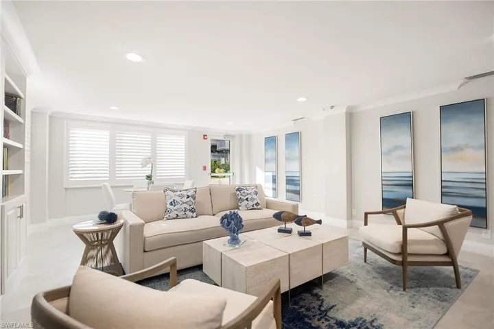 Living room featuring crown molding, recessed lighting, and light tile patterned flooring