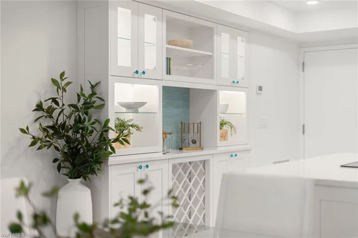 Entrance to kitchen with island and custom cabinetry