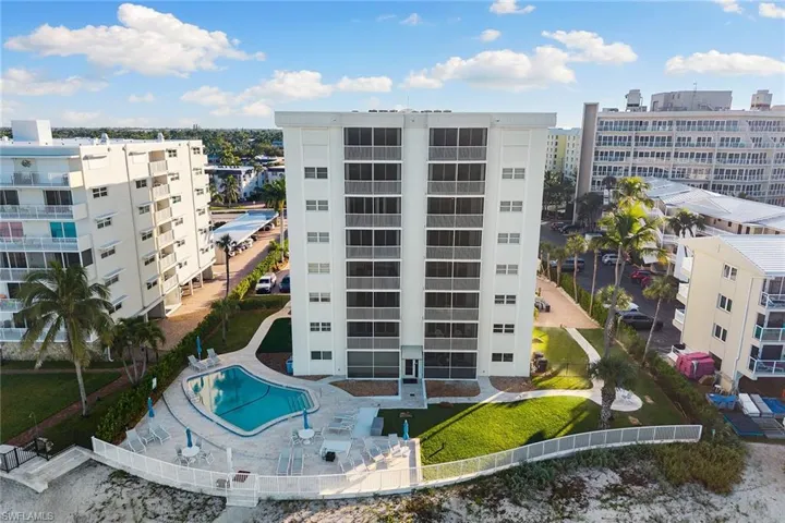 View of apartment building / complex featuring a community pool
