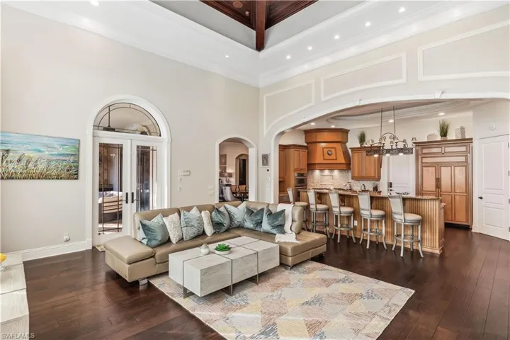The kitchen is open to the family room with a towering ceiling