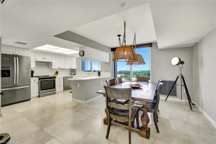 Dining room featuring visible vents, baseboards, and light tile patterned floors