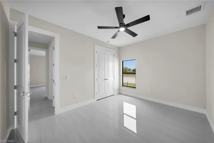 Unfurnished bedroom featuring a closet and a ceiling fan
