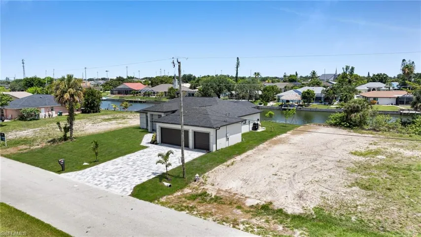 Aerial view of residential area with a nearby body of water