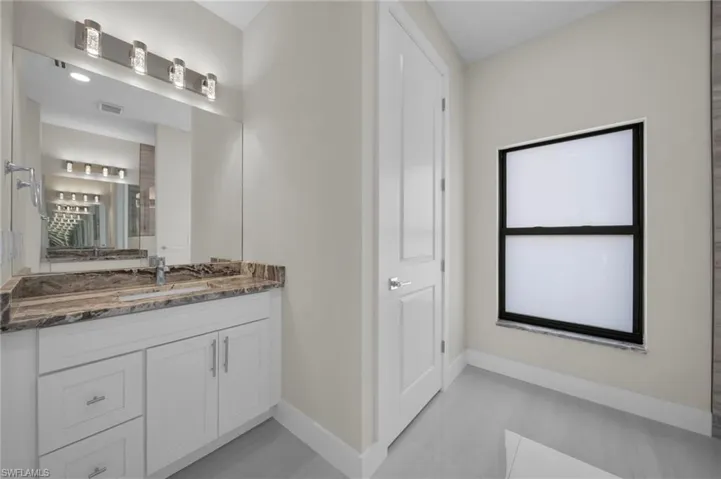 Bathroom with baseboards and vanity