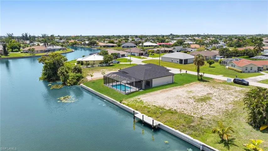 Aerial view of residential area with a large body of water
