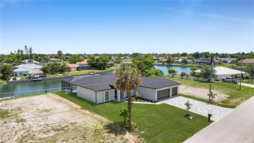 Aerial view of residential area with a large body of water