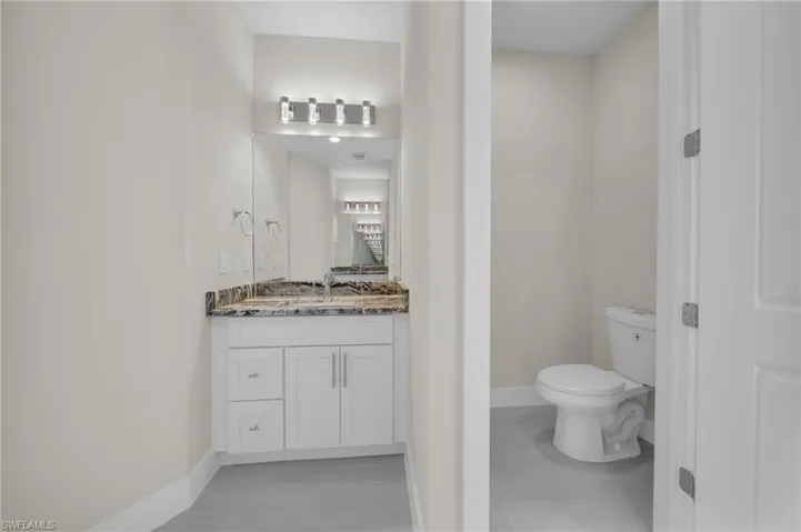 Bathroom with vanity and toilet