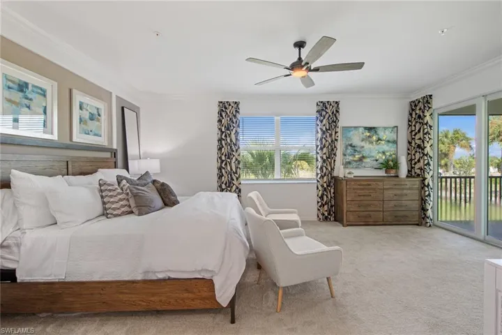 Bedroom with light colored carpet, access to exterior, ornamental molding, and a ceiling fan