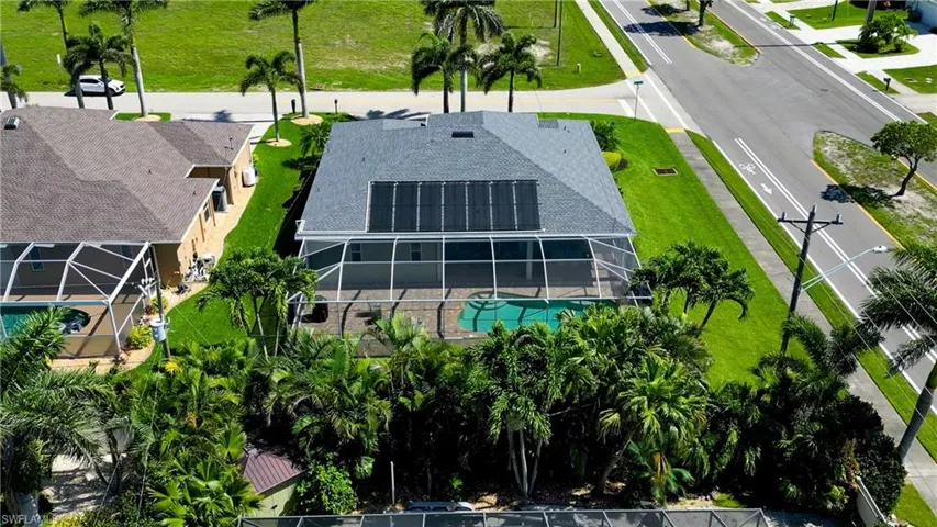 Aerial view of property and surrounding area with a pool area