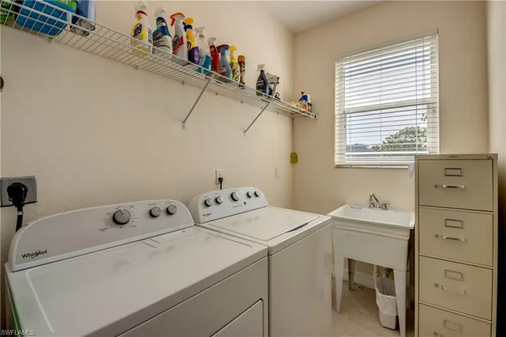 Laundry room featuring washer and clothes dryer