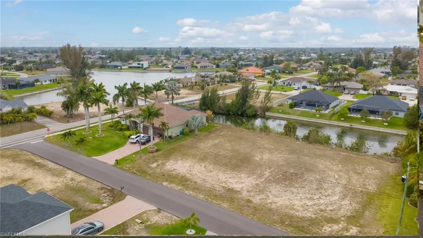 Aerial perspective of suburban area with a large body of water