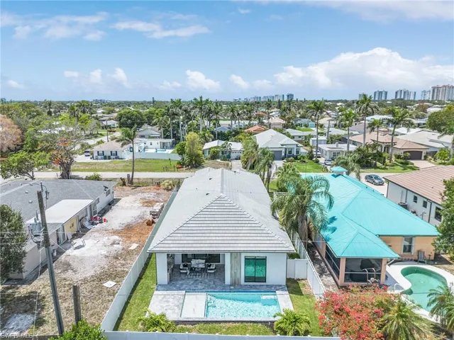 Aerial perspective of suburban area with a pool