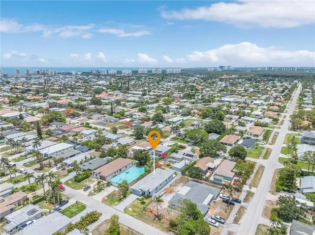 Aerial view of property's location featuring nearby urban area