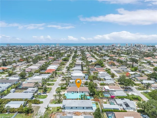 Aerial perspective of suburban area with a large body of water
